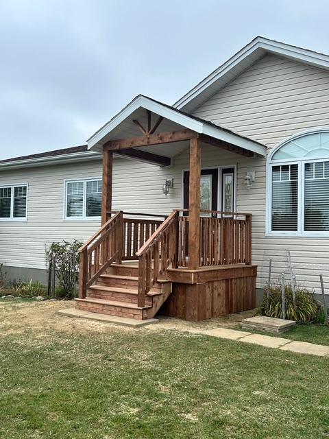 a new deck on the front of a house